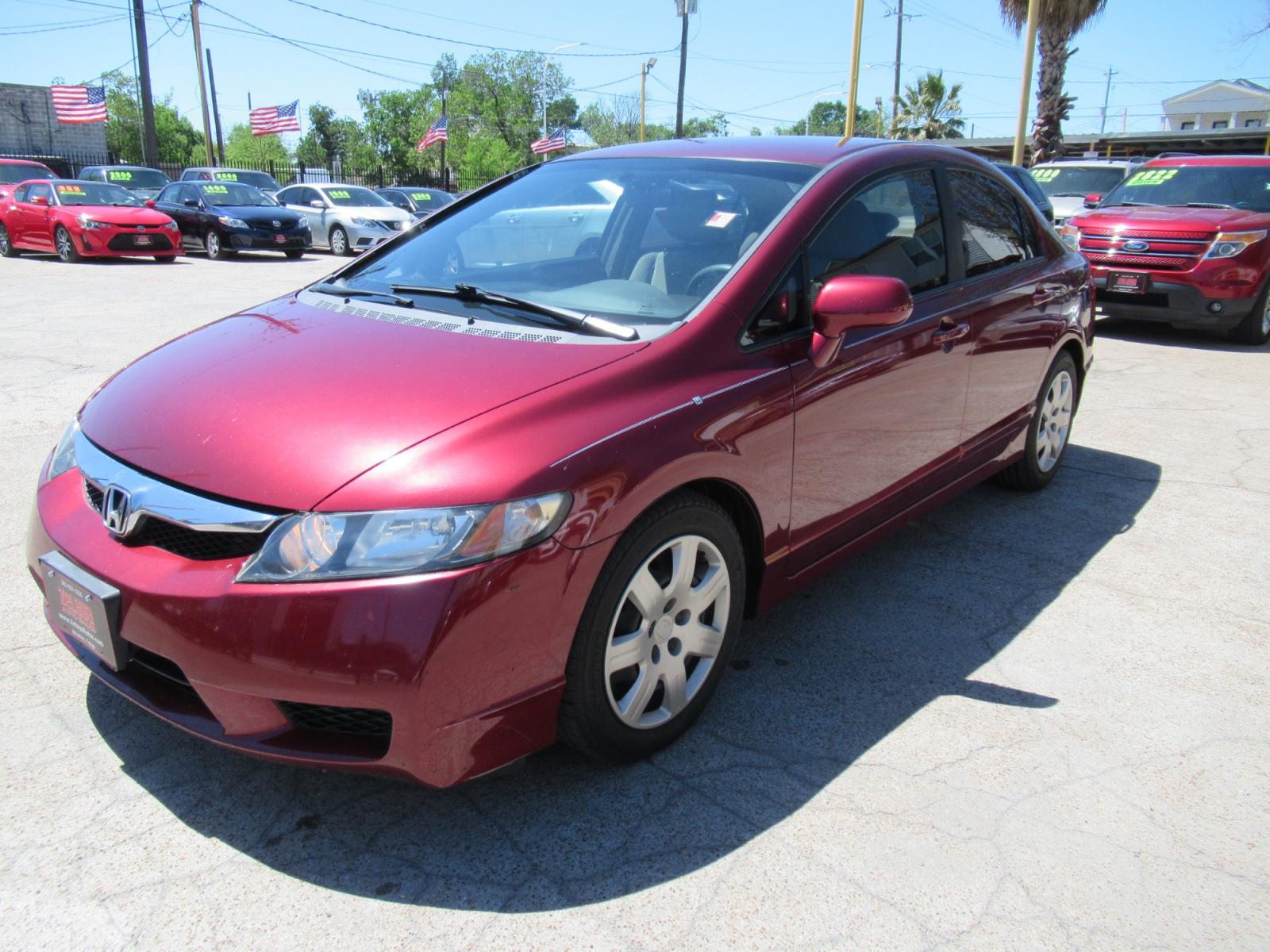 2009 Red /Tan Honda Civic LX Sedan AT (19XFA16529E) with an 1.8L L4 SOHC 16V engine, Automatic Overdrive transmission, located at 1511 North Shepherd Dr., Houston, TX, 77008, (281) 657-1221, 29.798361, -95.412560 - 2009 HONDA CIVIC LX VIN: 19XFA16529E042917 1 9 X F A 1 6 5 2 9 E 0 4 2 9 1 7 SEDAN 4 DR 1.8L I4 F SOHC 16V GASOLINE FRONT WHEEL DRIVE - Photo #20